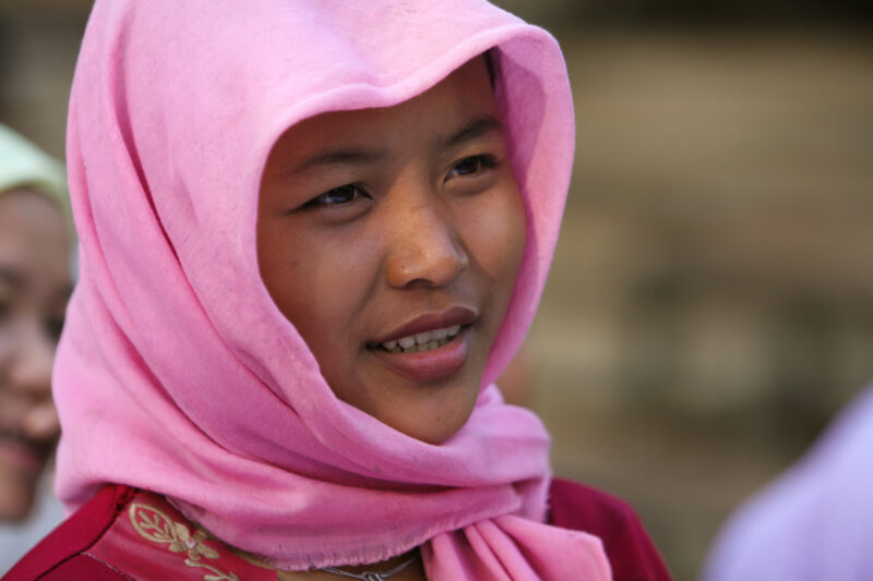 Learning to Read — Women in a Muslim village in Rural Cambodia gather to learn how to read, in a ADRA program that has come to their village — Cambodia, Wome...