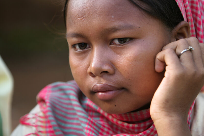 Learning to Read — Women in a Muslim village in Rural Cambodia gather to learn how to read, in a ADRA program that has come to their village — Cambodia, Wome...