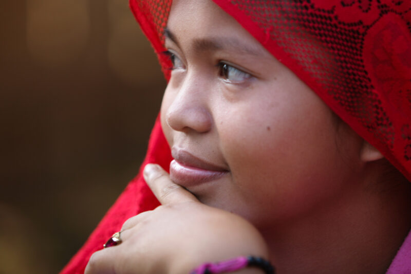 Learning to Read — Women in a Muslim village in Rural Cambodia gather to learn how to read, in a ADRA program that has come to their village — Cambodia, Wome...