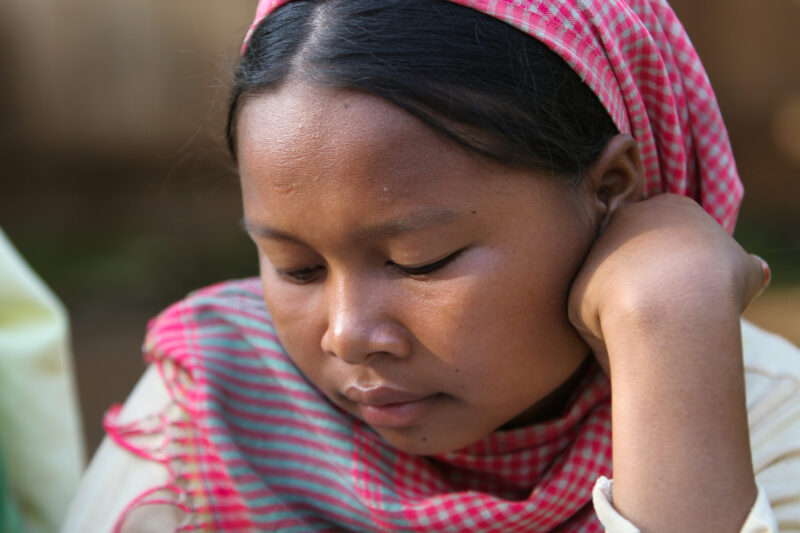 Learning to Read — Women in a Muslim village in Rural Cambodia gather to learn how to read, in a ADRA program that has come to their village — Cambodia, Wome...