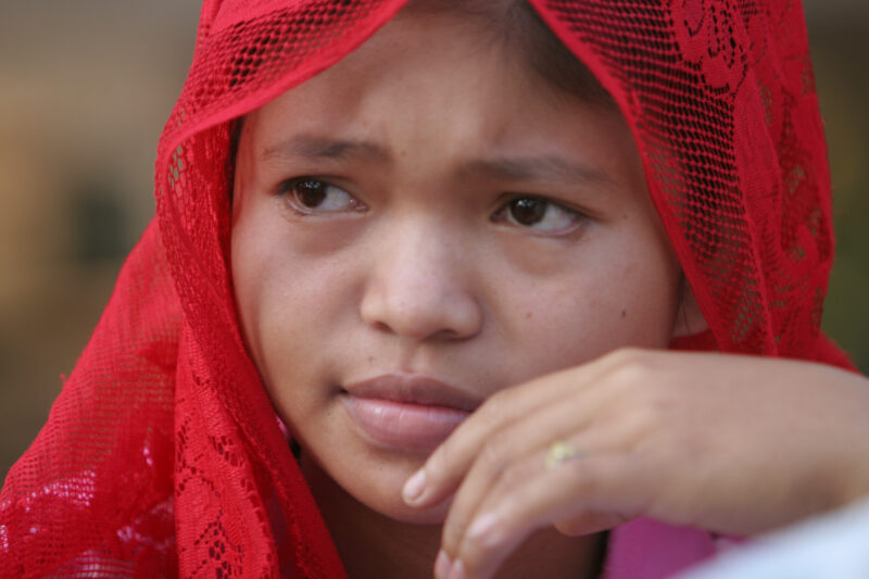 Learning to Read — Women in a Muslim village in Rural Cambodia gather to learn how to read, in a ADRA program that has come to their village — Cambodia, Wome...