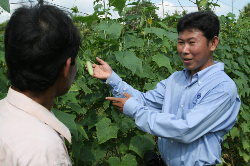 Agricultural Instruction in Cambodia — Stock Image of rural farmers getting agricultural instruction from an ADRA specialist. — Cambodia, farming, agricultur...