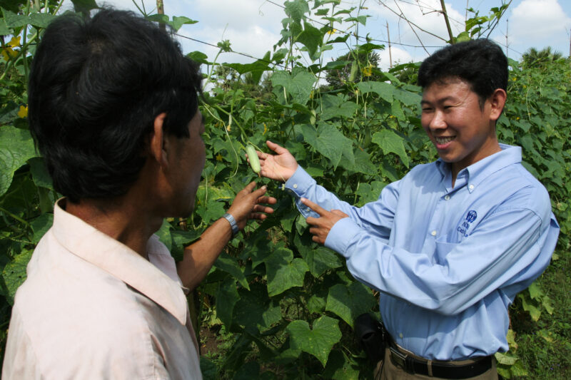 Agricultural Instruction in Cambodia — Stock Image of rural farmers getting agricultural instruction from an ADRA specialist. — Cambodia, farming, agricultur...