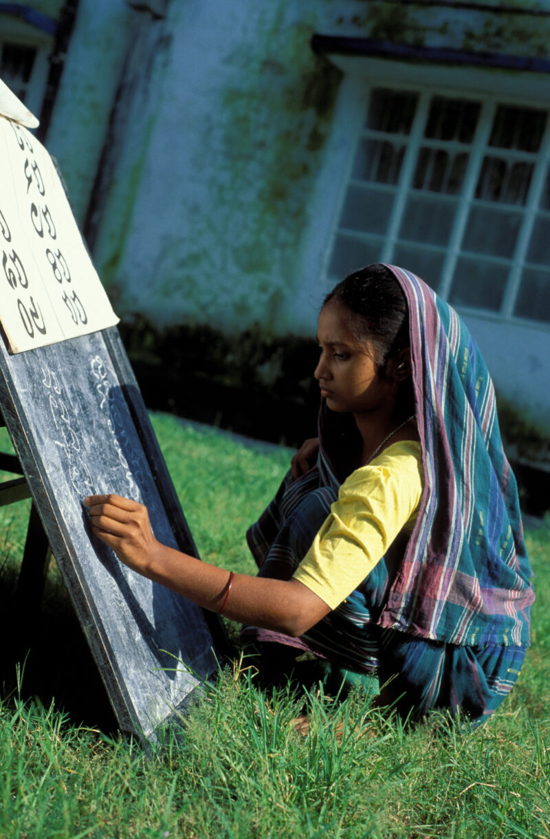 Adult Education in Bangladesh — Young woman in Bangladesh learns how to read and write at a Adult training program in Bangladesh — Adult Education, literacy ...