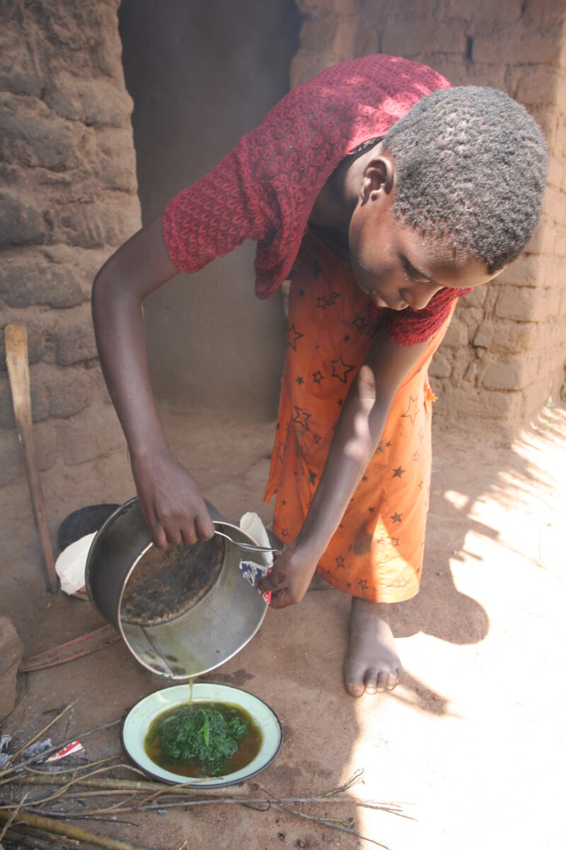 Girl Cooks Greens — Malawi, Africa, girl, girls, cooking