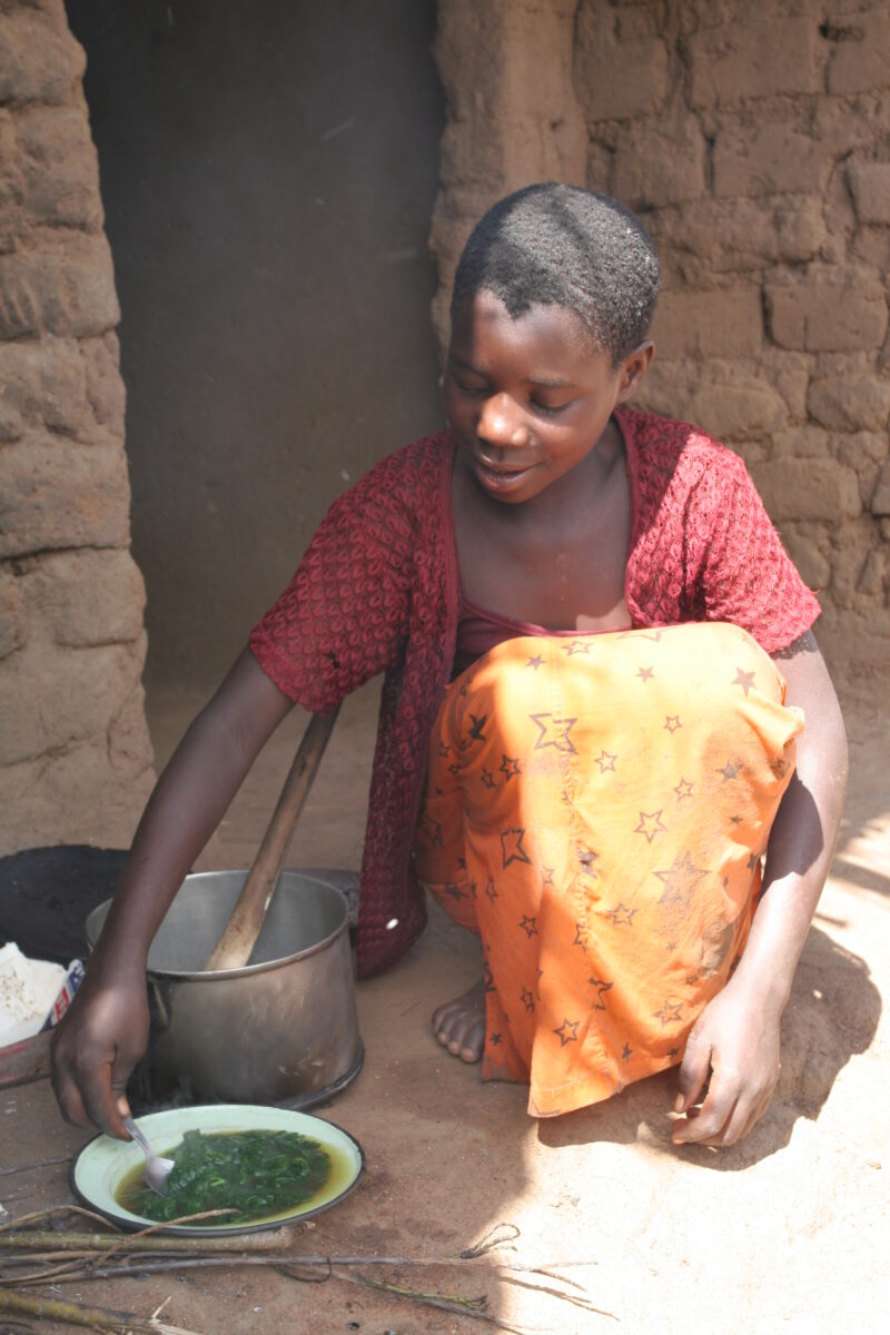 Girl Cooks Greens — Malawi, Africa, girl, girls, cooking