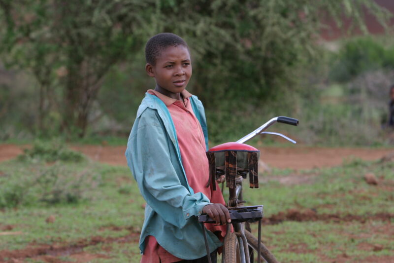 Girl and her Bicycle — Tanzania, Africa, Poverty, Development, Hanang