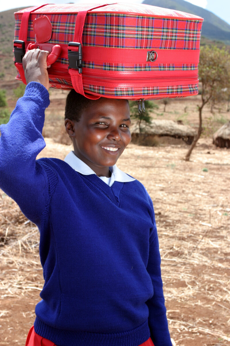 Girl and her suit Case — The beautiful children of Hanang District, Tanzania - Girl on her way to boarding school. — Tanzania, Africa, Hanang, faces, child
