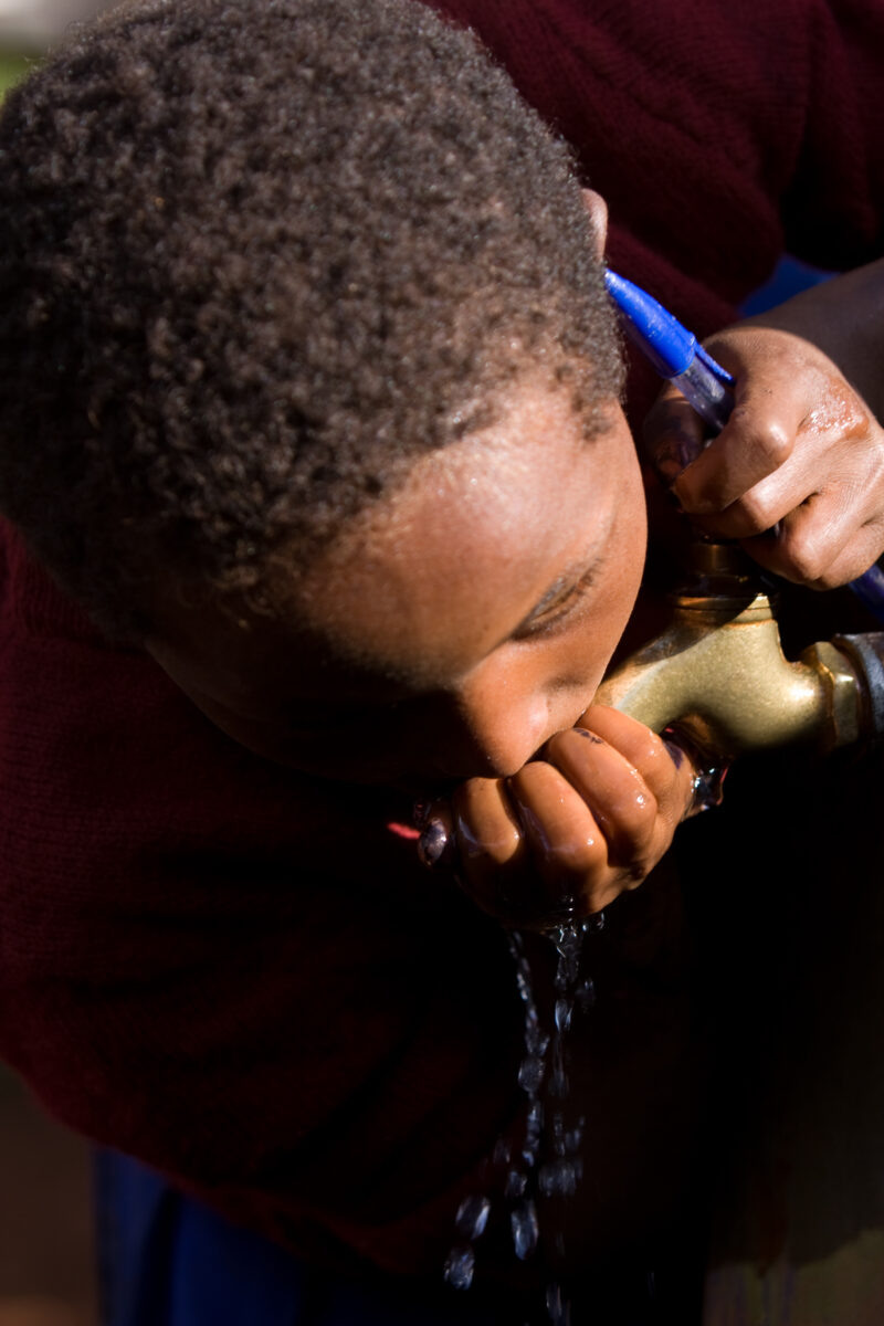 Getting a Drink — Students at an Elementary school in the Hanang district of Tanzania, Africa — ADRA, Africa, Development, Poverty, Tanzania