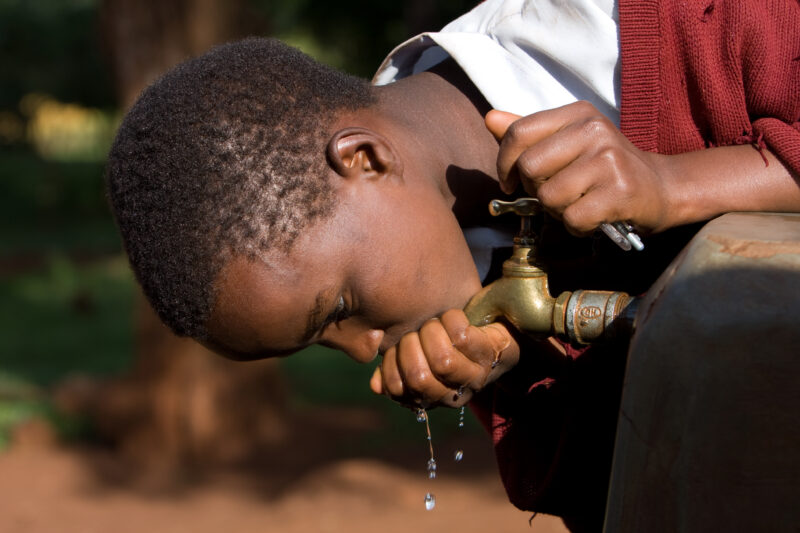 Getting a Drink — Students at an Elementary school in the Hanang district of Tanzania, Africa — ADRA, Africa, Development, Poverty, Tanzania
