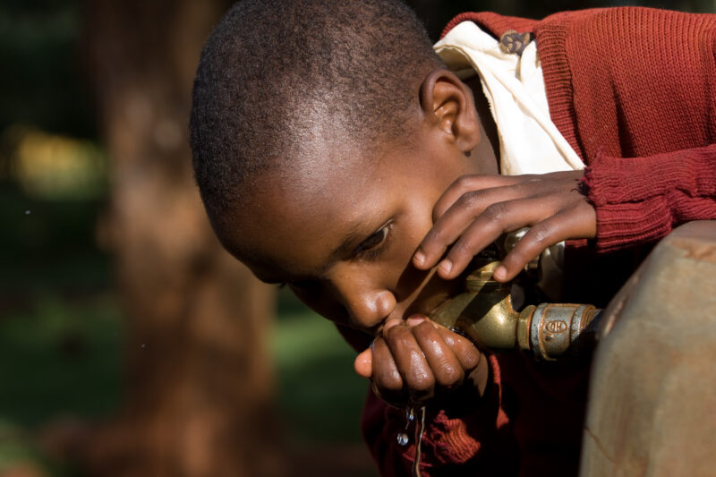 Getting a Drink — Students at an Elementary school in the Hanang district of Tanzania, Africa — ADRA, Africa, Development, Poverty, Tanzania
