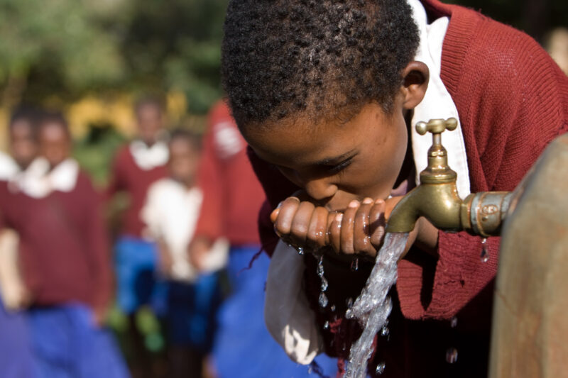 Getting a Drink — Students at an Elementary school in the Hanang district of Tanzania, Africa — ADRA, Africa, Development, Poverty, Tanzania