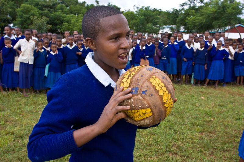 Girl with Ball — Students at an Elementary school in the Hanang district of Tanzania, Africa — ADRA, Africa, Development, Poverty, Tanzania