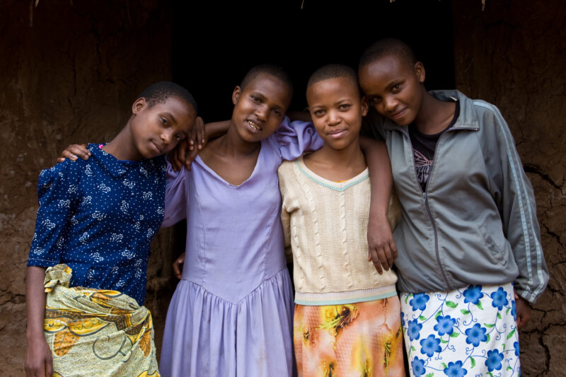 Girlfriends in Tanzania — Friends hang out after school in rural Tanzania. — ADRA, Africa, Development, Poverty, Tanzania