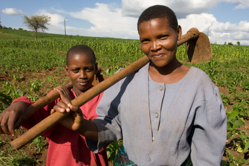 Mother and Daughter with Hoes — Villagers work together in the fields of Hanang District, Tanzania — ADRA, Africa, Development, Poverty, Tanzania