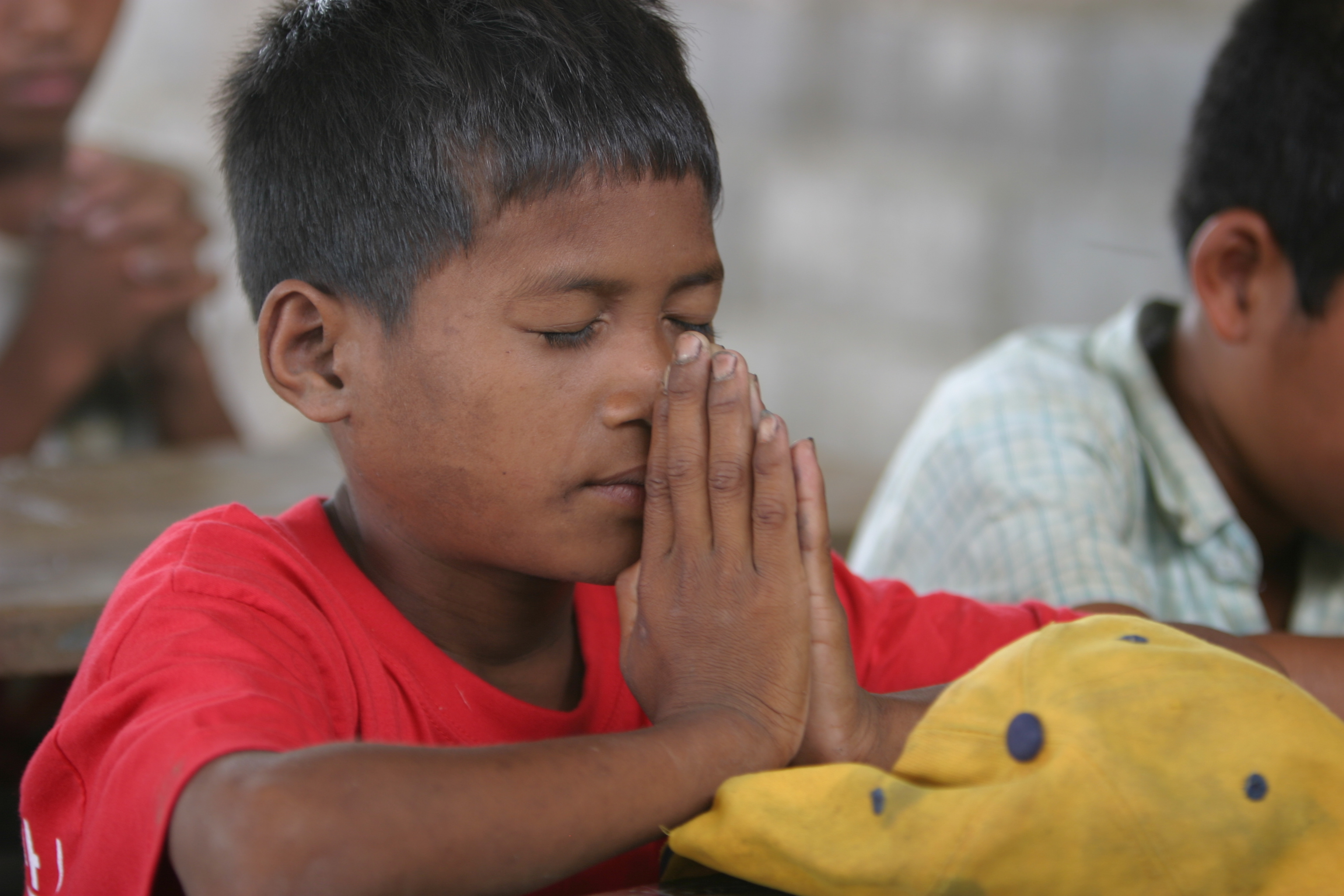 Child in Cambodia Praying