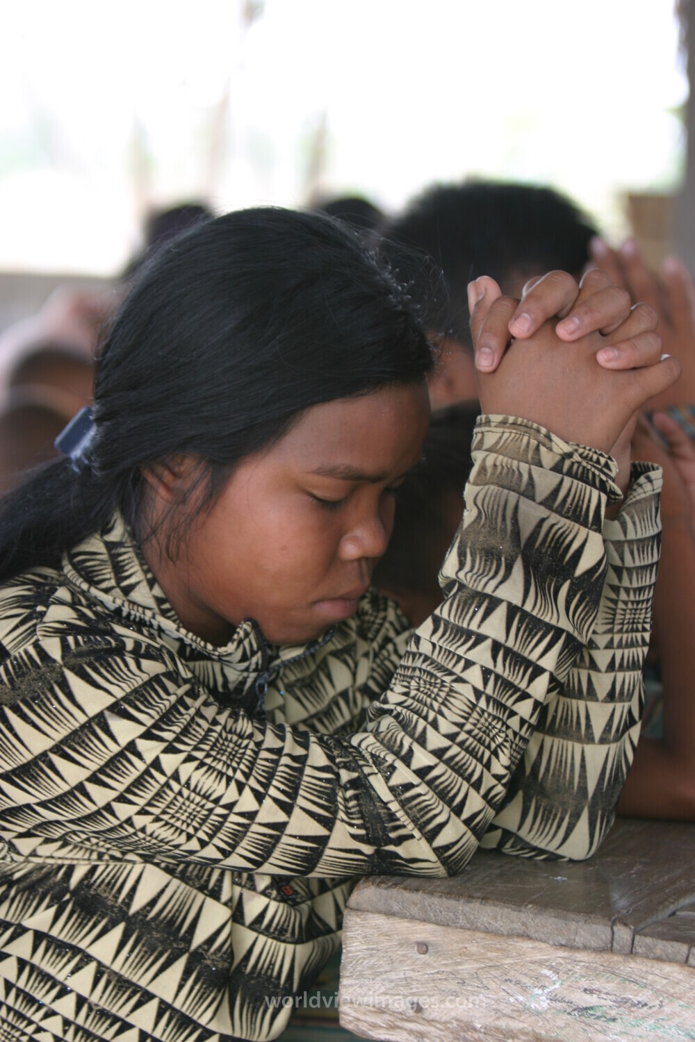 Child in Cambodia Praying