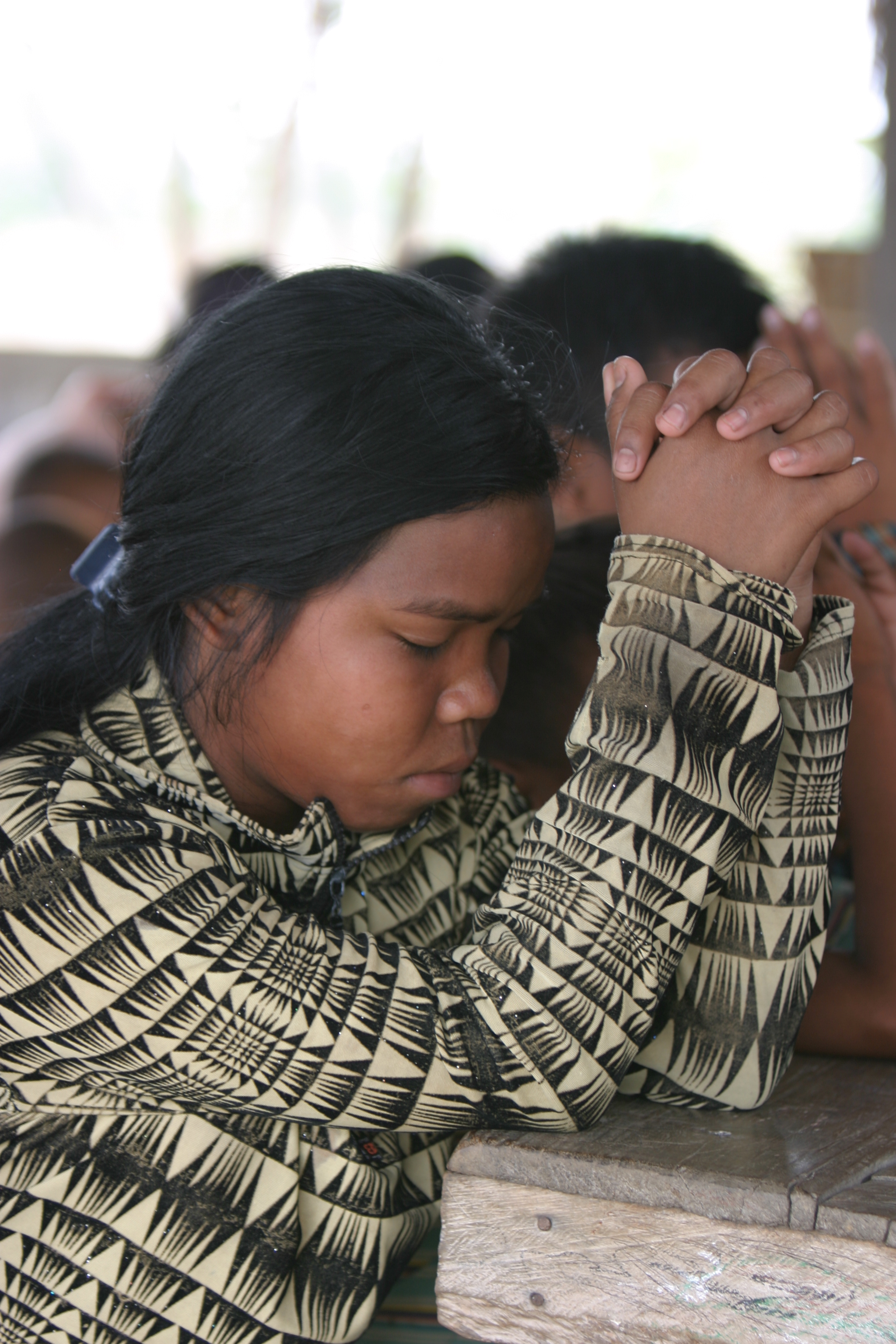 Child in Cambodia Praying