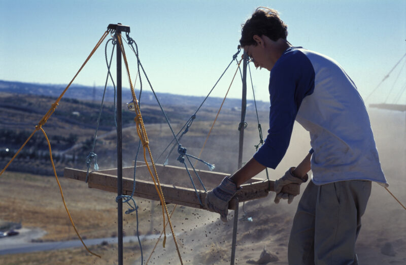 Sifting for Treasure — Students and Local workers, hired for the dig session, sift through the dirt that comes out of the squares, to catch small items like ...