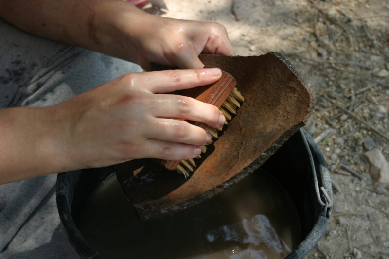 Pottery Washing — After digging up pottery shards all morning, it is time to wash them so that they can be dated according to know pottery styles. — Israel, ...