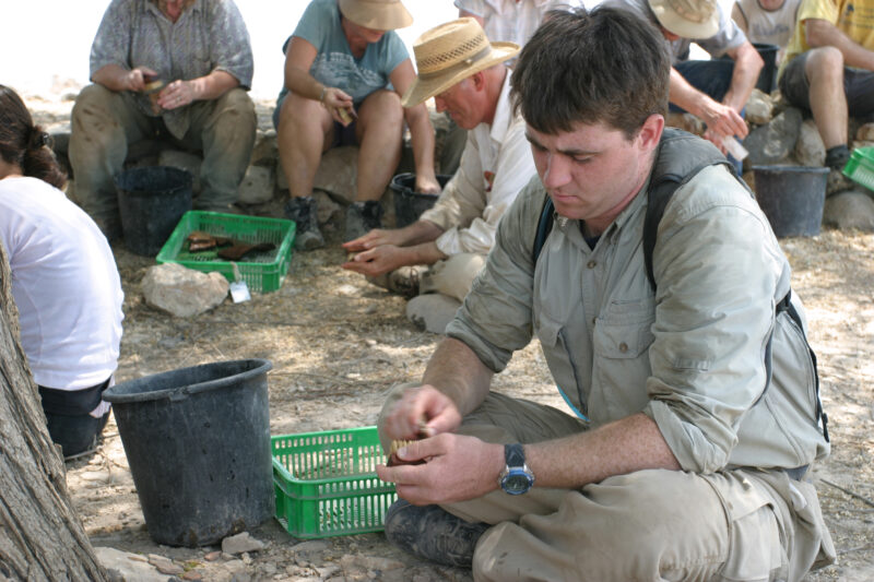 Pottery Washing — After digging up pottery shards all morning, it is time to wash them so that they can be dated according to know pottery styles. — Israel, ...