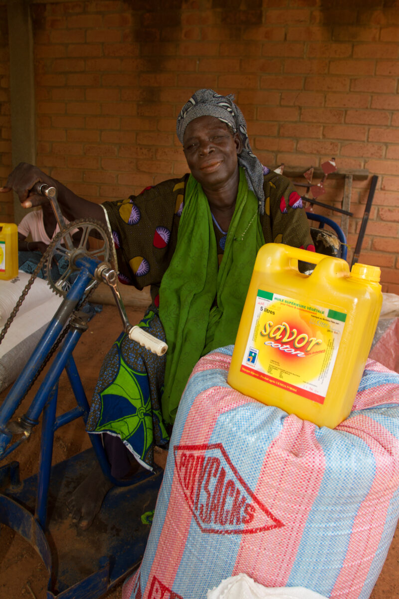 Receiving Food — Woman with disability poses with food that she has received from an Emergency food Distribution program sponsored by the Canadian Foodgrains...
