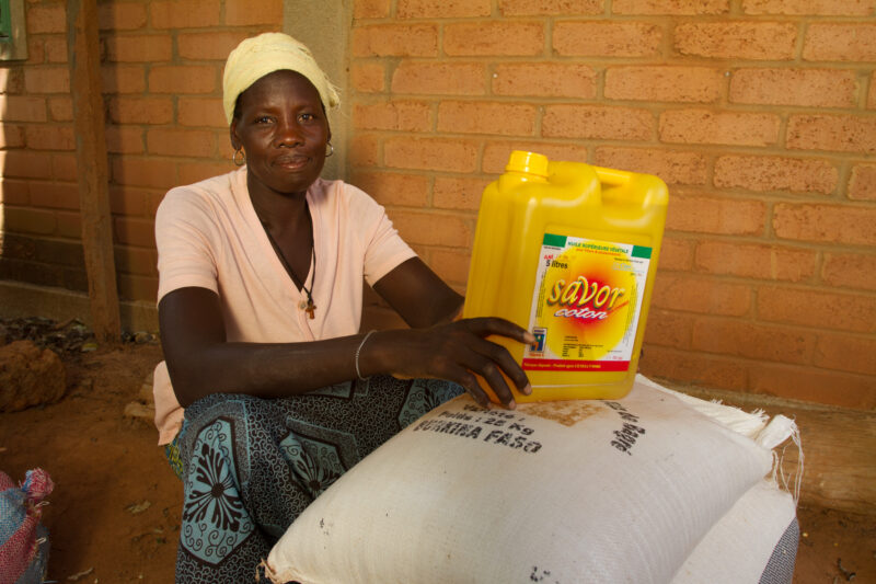 Receiving Food — Woman with disability poses with food that she has received from an Emergency food Distribution program sponsored by the Canadian Foodgrains...