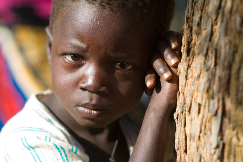 Boy by Tree — Boy in Burkina faso stands by Tree — Africa, West Africa, Burkina Faso, poor, poverty