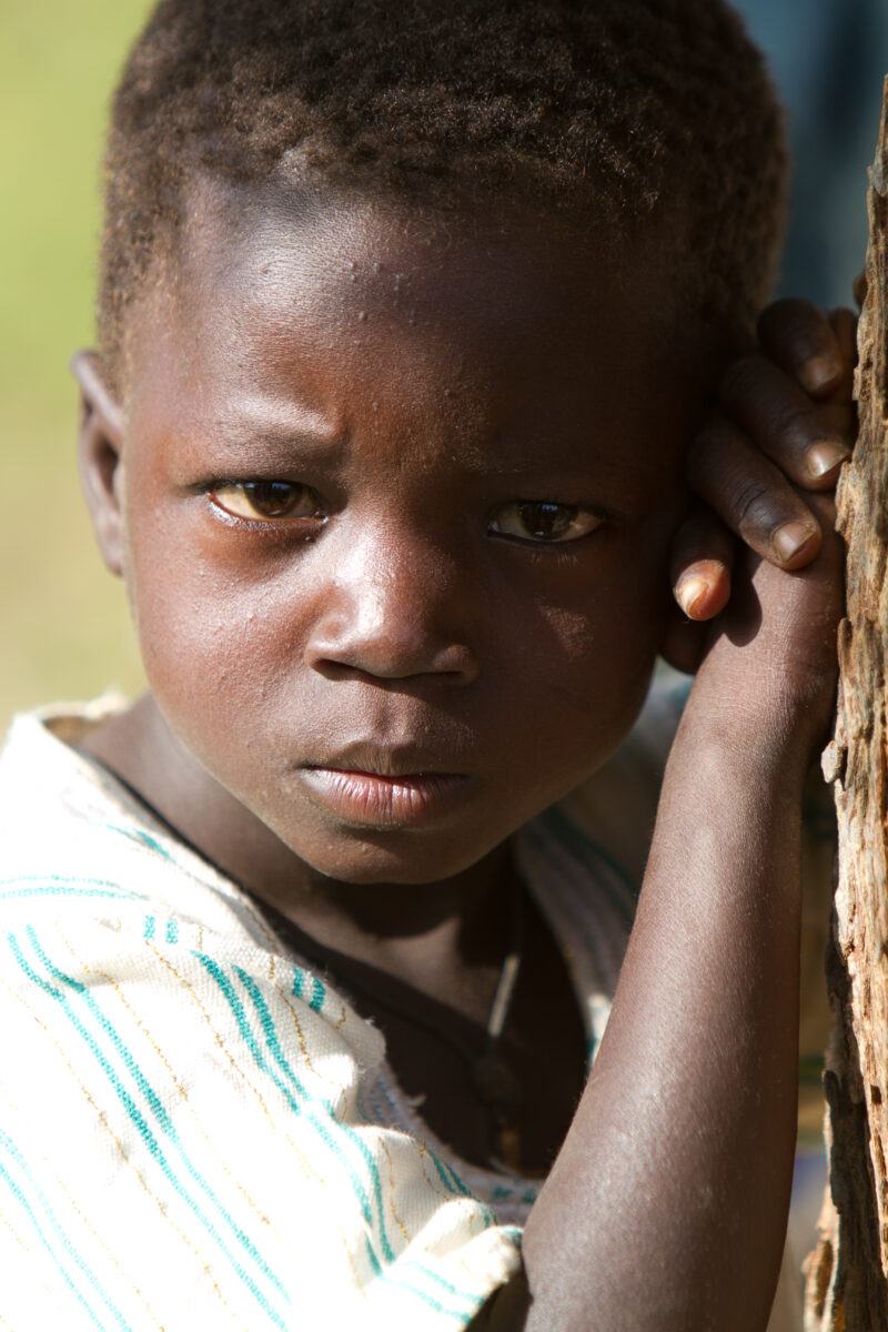 Boy by Tree — Boy in Burkina faso stands by Tree — Africa, West Africa, Burkina Faso, poor, poverty