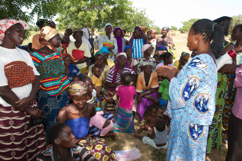 Health Education in Burkina Faso — Health workers share important information on nutrition and health in a remote village of Burkina Faso, Africa. — Africa, ...