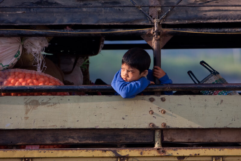 Boy in Burma — Burmese boy looks out from bus in Myanmar — ADRA, Burma, Myanmar