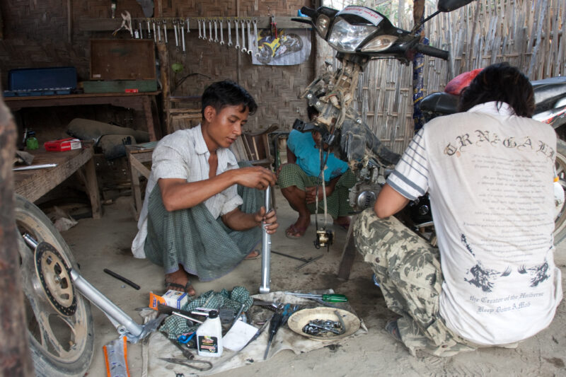 Myanmar — As part of a Income generation program, men learn the basics of small engine repair, in a dry zone of Burma — ADRA, Burma, Myanmar, income generati...