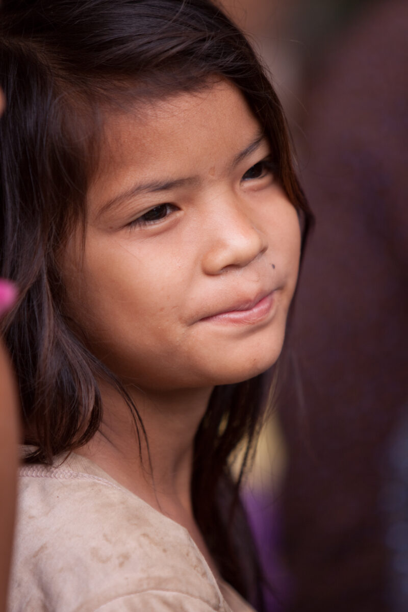 Faces of Cambodia — People living in poverty in rural Cambodia, listen to lecture on Health and Sanitation — Cambodia, ADRA, faces, children, girls
