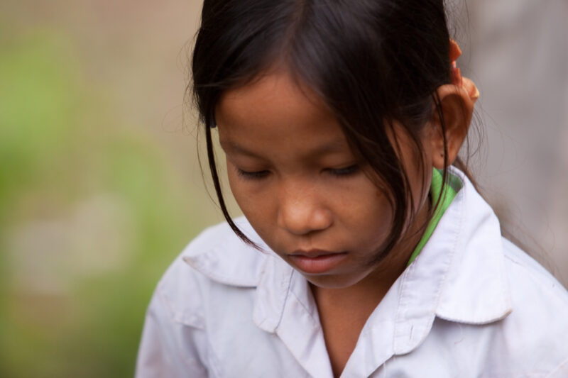 Faces of Cambodia — People living in poverty in rural Cambodia, listen to lecture on Health and Sanitation — Cambodia, ADRA, faces, children, girls