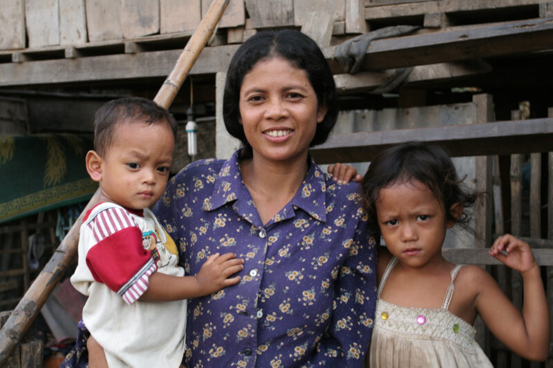 Mother and Children in Cambodia — Poor family by their house in rural Cambodia — Cambodia, children, faces, house, mother