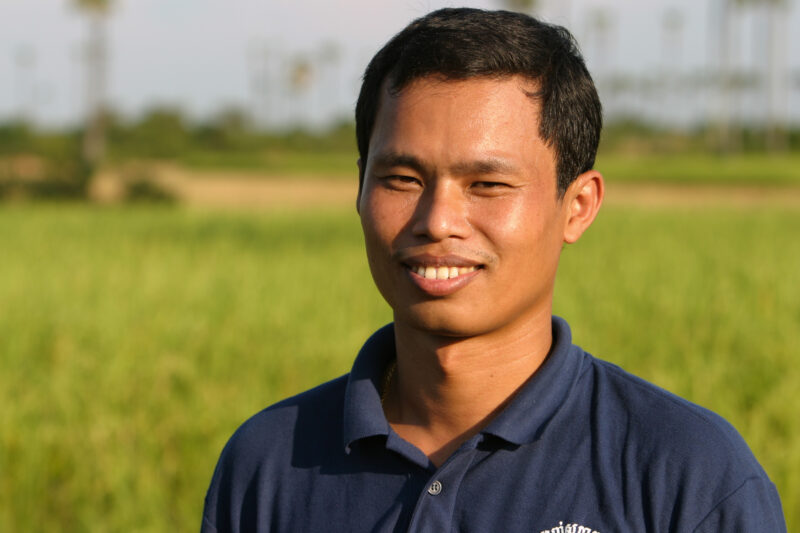 Man in Cambodia — Young man smiles in the Evening light on a farm in rural Cambodia — Cambodia, people, faces, men, Khmer