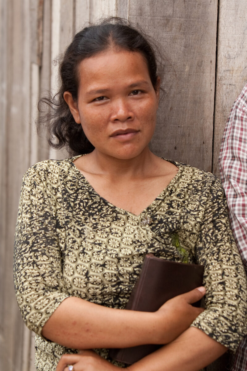 Woman with Bible in Cambodia — Woman holding Bible poses for Camera — Cambodia, woman, women, christian, Bible
