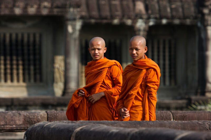 Buddhist Monks in Cambodia — Two Buddhist Monks walk around at the temple ruins of Angkor Wat in Siem Reap, Cambodia — Cambodia, Buddhist, Buddhism, monks, r...
