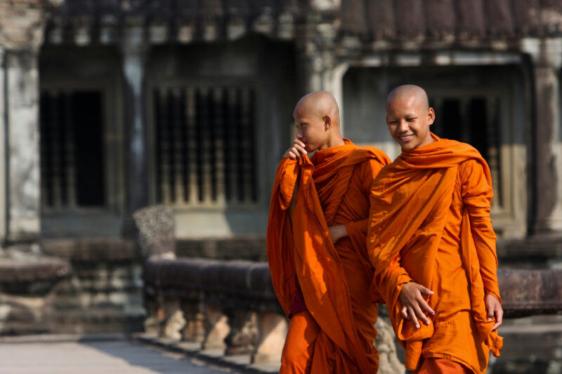 Buddhist Monks in Cambodia — Two Buddhist Monks walk around at the temple ruins of Angkor Wat in Siem Reap, Cambodia — Cambodia, Buddhist, Buddhism, monks, r...