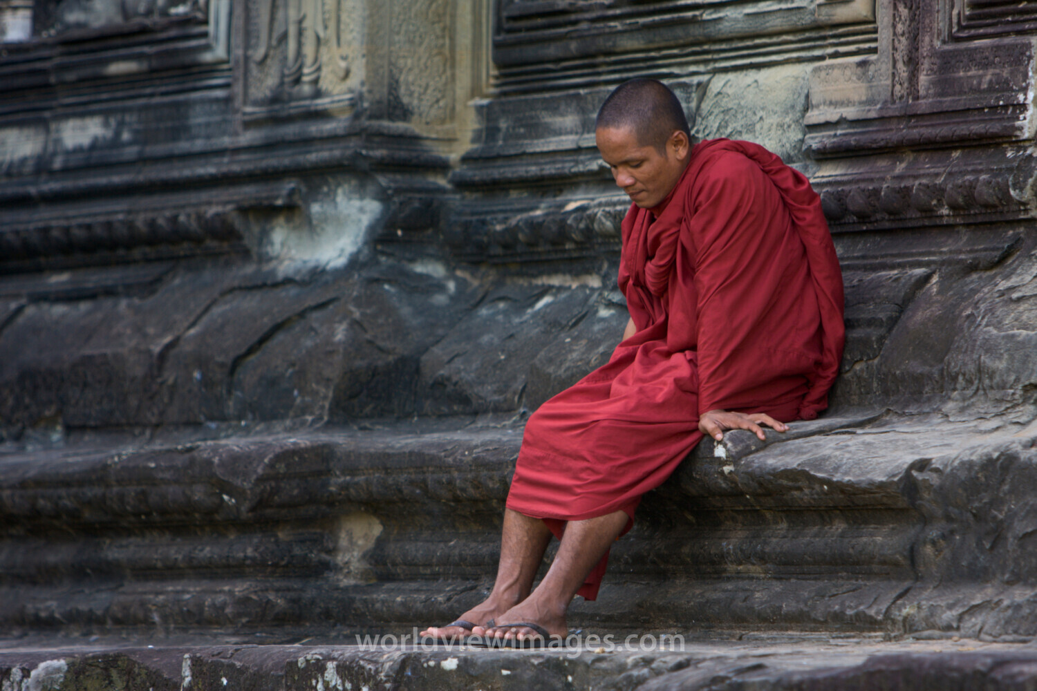 Monk on the Steps of Angkor Wat
