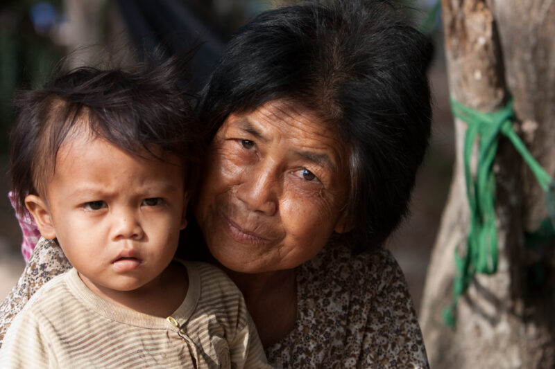 Grandmother and Baby in Cambodia — Stock Image of older woman with baby in Cambodia — Cambodia, woman, women, baby, babies