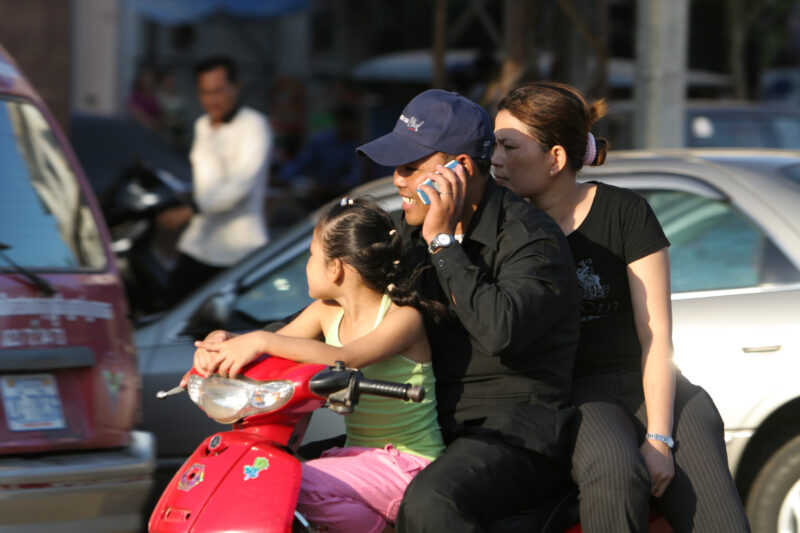 Daily Commute by Moterbike — People travel to work on motorbike in Phnom Penh, Cambodia — Cambodia, street, streets, traffic, motorcycle