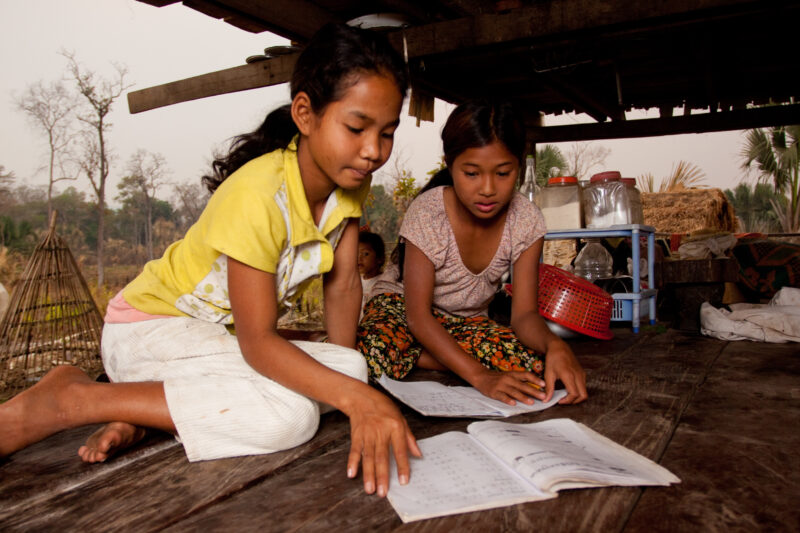 Doing Homework in Cambodia — Girls do homework in cambodia — Cambodia, Rural, students, education, school