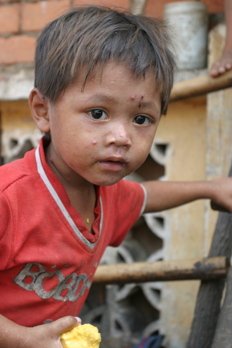 Boy In Cambodia — Stock image of young boy living in poverty in Rural Cambodia — Cambodia, Boy, boys, poverty, child