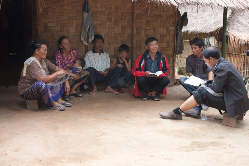 Bible Study in Laos — Ethnic Minority people study the Bible with a Adventist Pastor visiting their village in Laos — Laos, Southeast Asia, Bible Study, Chri...