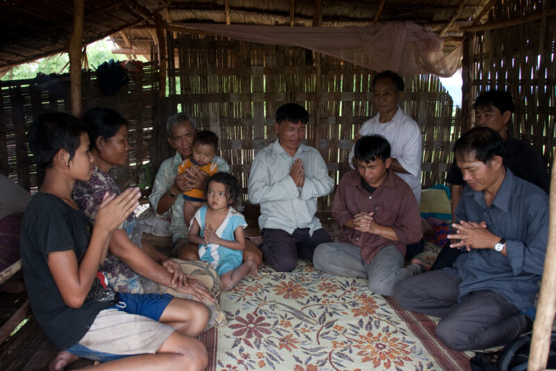 Prayer in Laos — Ethnic Minority people pray at a house church in Laos — Laos, Southeast Asia, Bible Study, Christian, Christianity