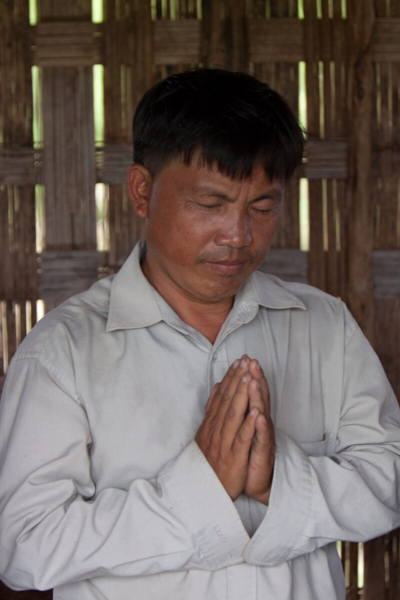 Prayer in Laos — Ethnic Minority people pray at a house church in Laos — Laos, Southeast Asia, Bible Study, Christian, Christianity