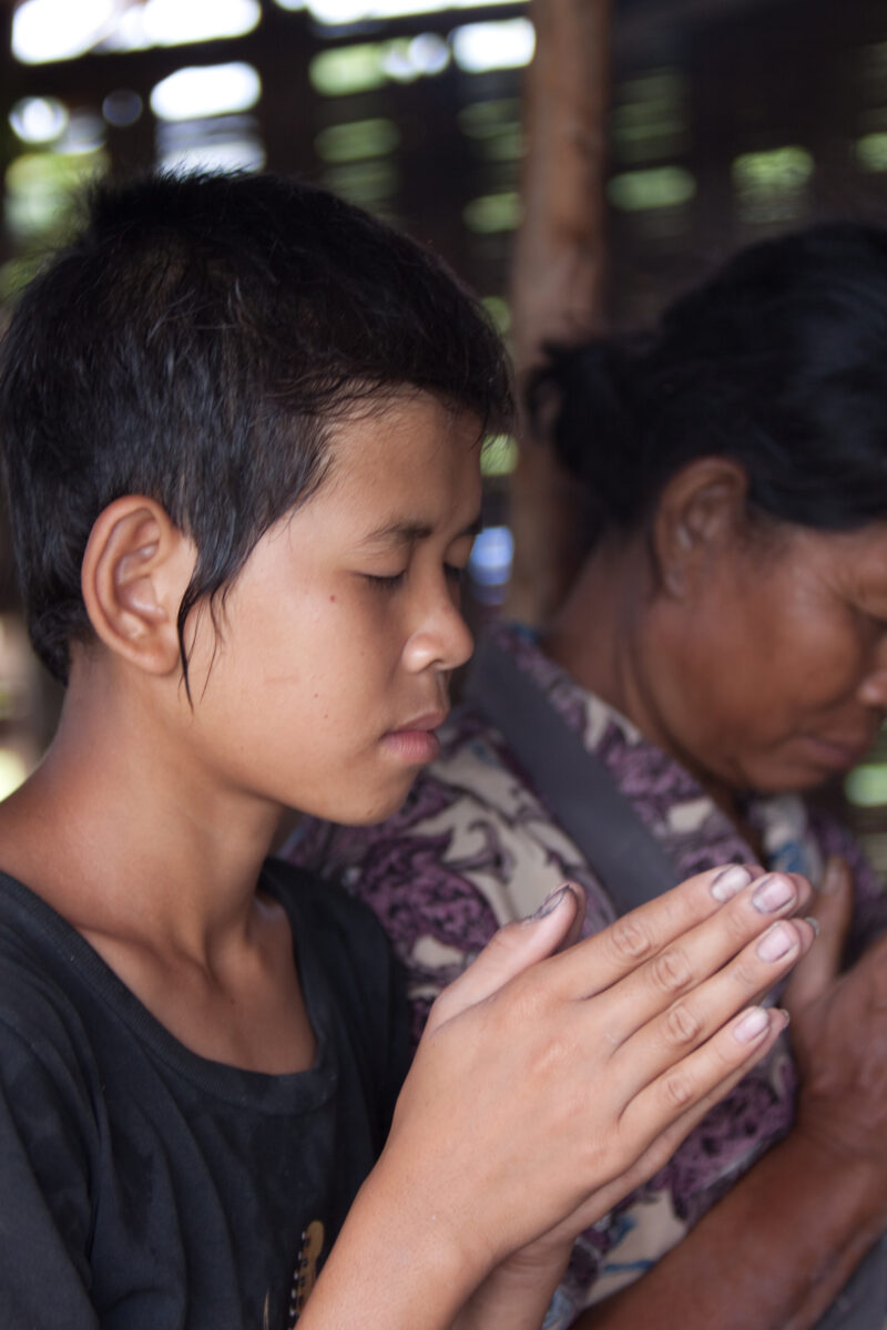 Prayer in Laos — Ethnic Minority people pray at a house church in Laos — Laos, Southeast Asia, Bible Study, Christian, Christianity