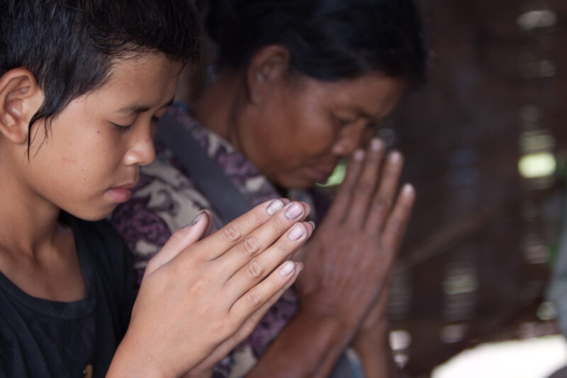 Prayer in Laos — Ethnic Minority people pray at a house church in Laos — Laos, Southeast Asia, Bible Study, Christian, Christianity