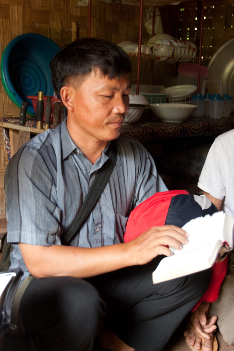 Bible Study in Laos — Ethnic Minority people study the Bible with a Adventist Pastor visiting their village in Laos — Laos, Southeast Asia, Bible Study, Chri...